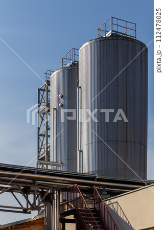 Brewery silos or tanks typically use for storing barley or fermented beer. 112478025