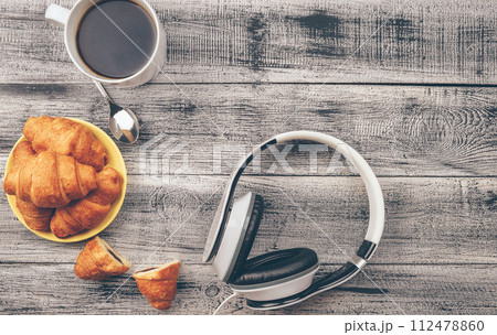 Croissants close-up. Freshly baked croissants. Warm Fresh Buttery Croissants . Coffee. 112478860