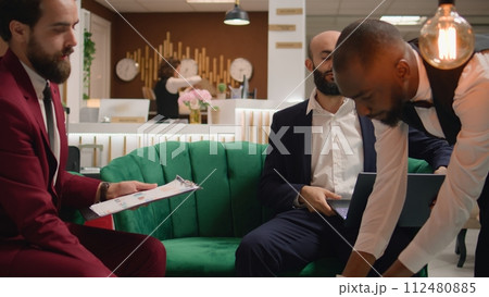 Diverse colleagues engage in business related activities, highlighting collaboration and teamwork for international company development. Business partners exchanging new corporate ideas. 112480885