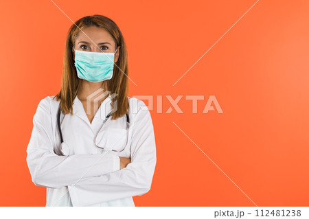 Confident Female Doctor Or Nurse Wearing Surgical Mask And Stethoscope 112481238