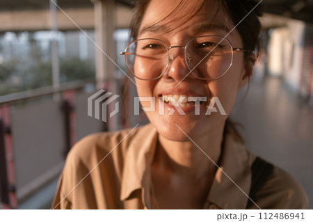 Woman making funny hilarious face to camera. 112486941