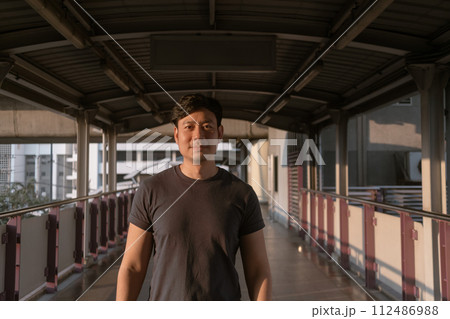Man is walking on the bridge in the city. Man is walking on the bridge in the city. 112486988