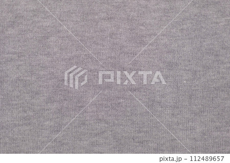 Soft Knitted Woolen Detailed Texture. Natural Fabric Closeup Knit Pattern. Gray Knitwear, Warm Cashmere Surface. Rotation, Macro. Cozy Textile Background. Clothes Production. Melange Yarn. 4K Shot 112489657