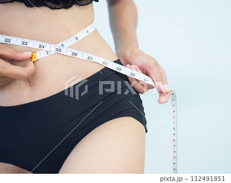 Measuring Waist Woman Tape Slim Fit Cropped Healthy Perfect Body, Thin Girl Checking Muscle Balance waistline Meter Control Diet Food and Fitness Gym Sport Yoga, Attractive Sexy Shape Weightloss. 112491851