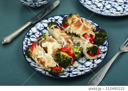 Meat rolls with broccoli and pepper. Meat rolls with broccoli and pepper. 112495222