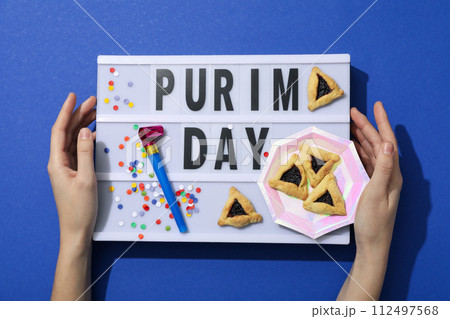 Purim holiday concept, with traditional symbols and decor. Purim holiday concept, with traditional symbols and decor. 112497568