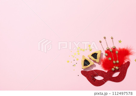 A mask with traditional cookies for the day of Purim. A mask with traditional cookies for the day of Purim. 112497578