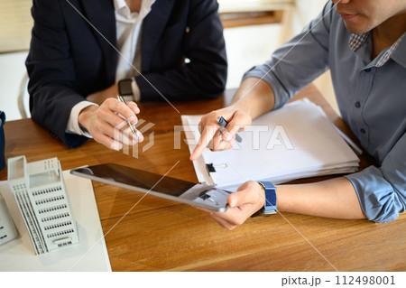 Cropped shot of investors using digital tablet and planning for new construction project at office 112498001