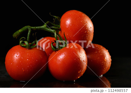 Fresh ripe red tomatoes branch 112498557