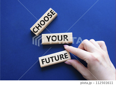 Choose your future symbol. Wooden blocks with words Choose your future. Beautiful deep blue background. Businessman hand. Business and Choose your future concept. Copy space. Choose your future symbol. Wooden blocks with words Choose your future. Beautiful deep blue background. Businessman hand. Business and Choose your future concept. Copy space. 112501611