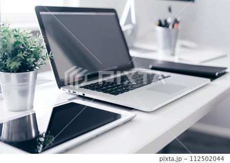 AI-generated content. Clean home office setup with open laptop 112502044