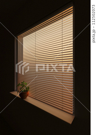 Sunset through the blinds 112502073