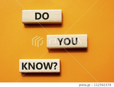 Do you know symbol. Concept word Do you know on wooden cubes. Beautiful orange background. Business and Do you know concept. Copy space. Do you know symbol. Concept word Do you know on wooden cubes. Beautiful orange background. Business and Do you know concept. Copy space. 112502378