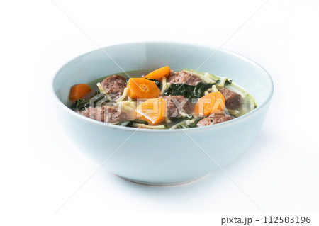 Italian Wedding Soup with meatballs and spinach isolated on white background 112503196