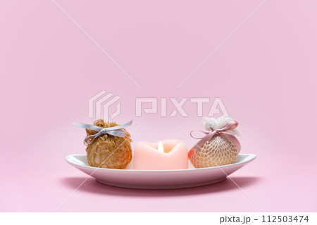 Eggs decorated with ribbons on a plate. Easter background 112503474