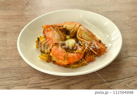 stir fried river shrimp in yellow curry and egg on plate stir fried river shrimp in yellow curry and egg on plate 112504896