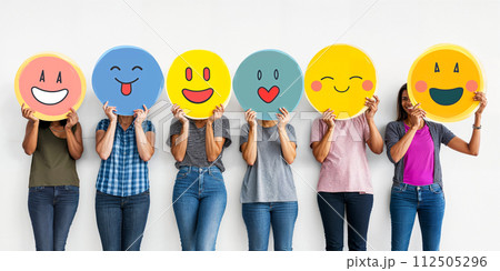 Healthy workplace culture concept. A group of diverse people holding happy emoticons. Teamwork 112505296