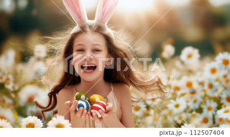 child with painting eggs outdoors child with painting eggs outdoors 112507404