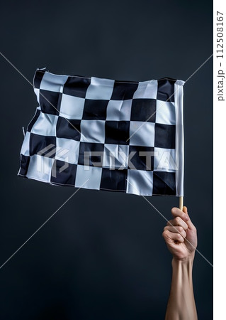 Checkered flag in hand. Racing, the concept of start, finish Checkered flag in hand. Racing, the concept of start, finish 112508167