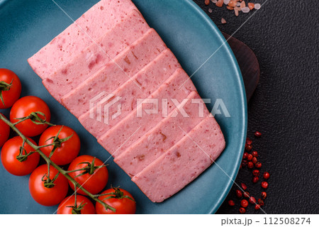 Delicious canned pink ham with salt, spices and herbs Delicious canned pink ham with salt, spices and herbs 112508274