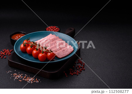 Delicious canned pink ham with salt, spices and herbs 112508277
