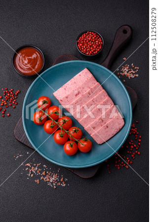Delicious canned pink ham with salt, spices and herbs Delicious canned pink ham with salt, spices and herbs 112508279