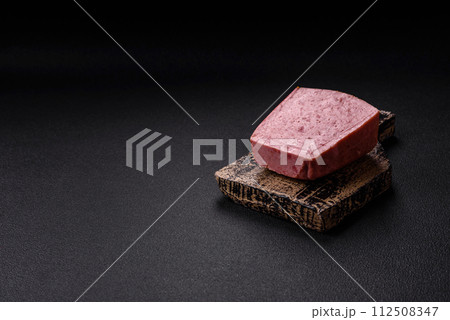 Delicious canned pink ham with salt, spices and herbs 112508347