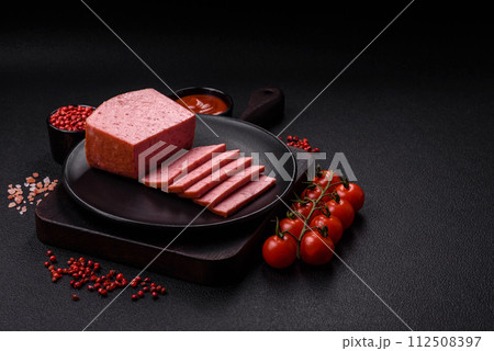 Delicious canned pink ham with salt, spices and herbs Delicious canned pink ham with salt, spices and herbs 112508397