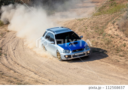 Rally Car in a Turn and a Cloud of Dust 23 112508637