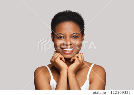 Joyful female model face close-up. African American woman portrait. Joyful female model face close-up. African American woman portrait. 112509323