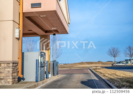 Banking automated teller machine lane in a small town 112509456