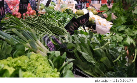 Bunch of fresh green vegetables in grocery store. Healthy lifestyle and organic vegetarian food concept Bunch of fresh green vegetables in grocery store. Healthy lifestyle and organic vegetarian food concept 112510177