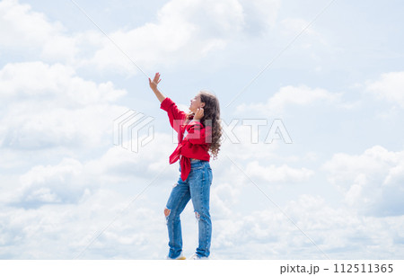 Her perfect style. happy moment in childhood. kid on sky background. Her perfect style. happy moment in childhood. kid on sky background. 112511365