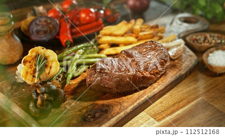 Beef Steak Ready for Eating, Served on Wooden Table. Beef Steak Ready for Eating, Served on Wooden Table. 112512168