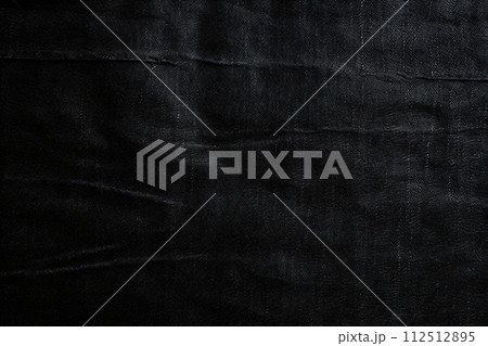 Close-up of white thread stitching on black denim fabric Close-up of white thread stitching on black denim fabric 112512895