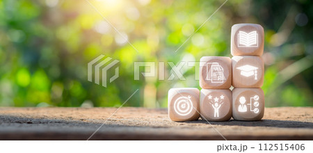 Scholarship concept, Wooden block on desk with scholarship icon on virtual screen. 112515406