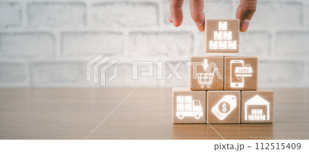 Shopping process concept, Hand holding wooden block on desk with shopping process icon on virtual screen. 112515409