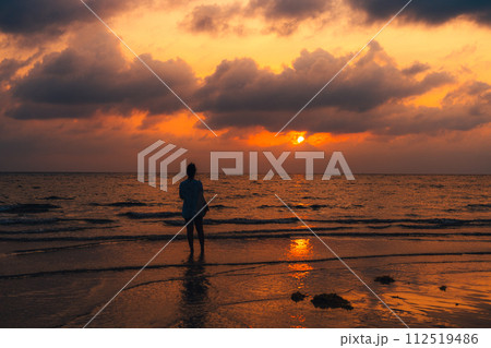 Sunset at sea with orange sky and waves 112519486