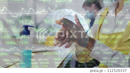 Image of digital interface showing statistics and globe with man disinfecting hands wearing face mas Image of digital interface showing statistics and globe with man disinfecting hands wearing face mas 112520337