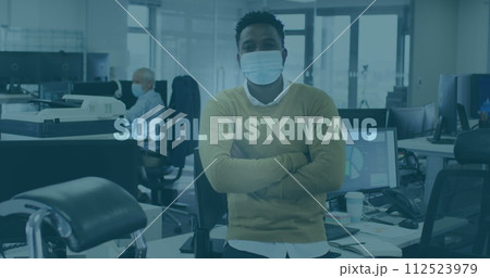 Image of words flashing with colleagues in office wearing face masks Image of words flashing with colleagues in office wearing face masks 112523979