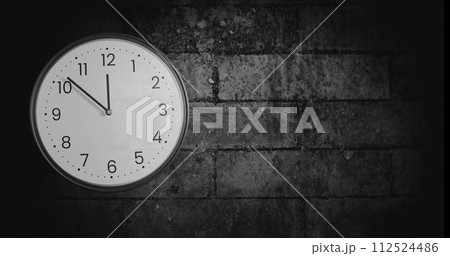 Image of clock ticking over brick wall background Image of clock ticking over brick wall background 112524486