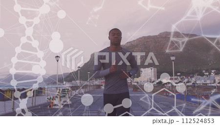 Image of shapes and dna strand over african american man running on promenade Image of shapes and dna strand over african american man running on promenade 112524853