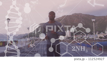 Image of shapes and dna strand over african american man running on promenade Image of shapes and dna strand over african american man running on promenade 112524927