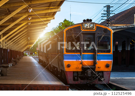 Diesel train trains with traditional public transport Thai style for commuting train approaches Phitsanulok Railway Station city in Thailand 112525496