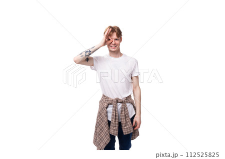young cheerful positive european male student with golden red hair wearing glasses on white 112525825