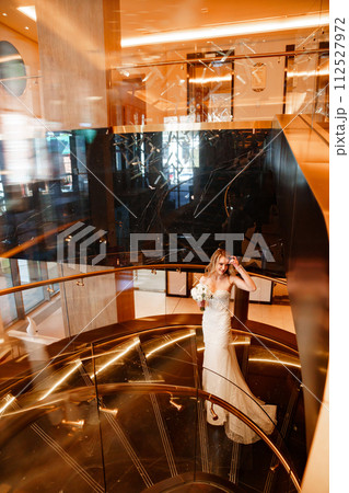 Bride on a golden spiral staircase. Bride on a golden spiral staircase. 112527972