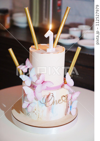 Two-tier butterfly cake for a girl's first birthday. Two-tier butterfly cake for a girl's first birthday. 112527979
