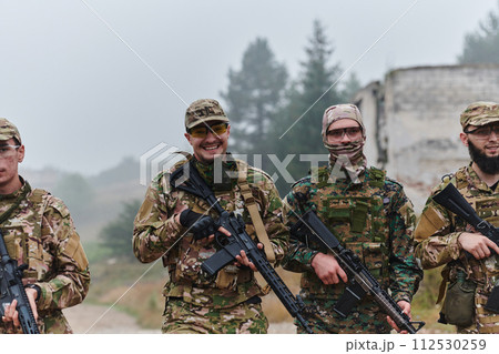 A disciplined and specialized military unit, donned in camouflage, strategically patrolling and maintaining control in a high-stakes environment, showcasing their precision, unity, and readiness for 112530259