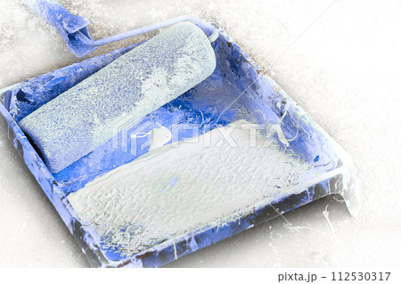 Painter craftsman artist tray,roller for painting,workplace with blue paint 112530317