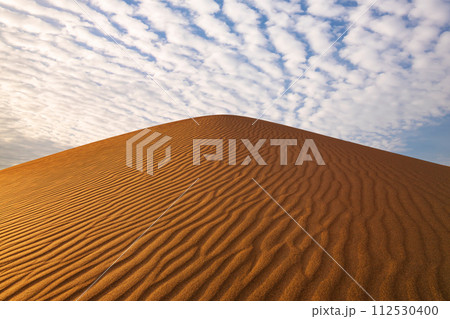 Sunset over the sand dunes in the desert. Sahara desert 112530400